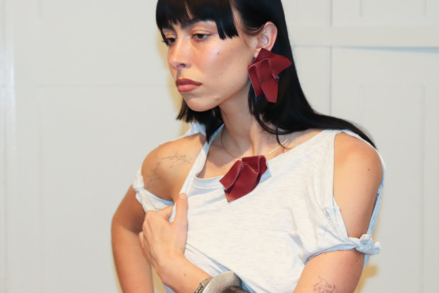 folded pleated red leather pendant on choker 