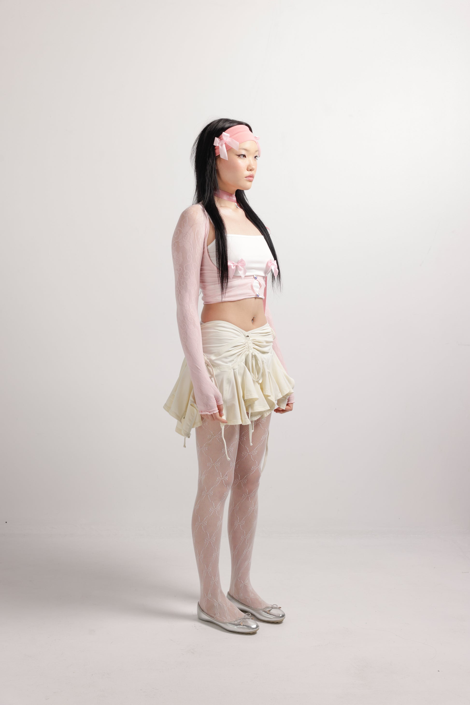 girl wearing white lace tights with bows on them | Lace Me Up Tights in White | Bow tights | Baobei Label