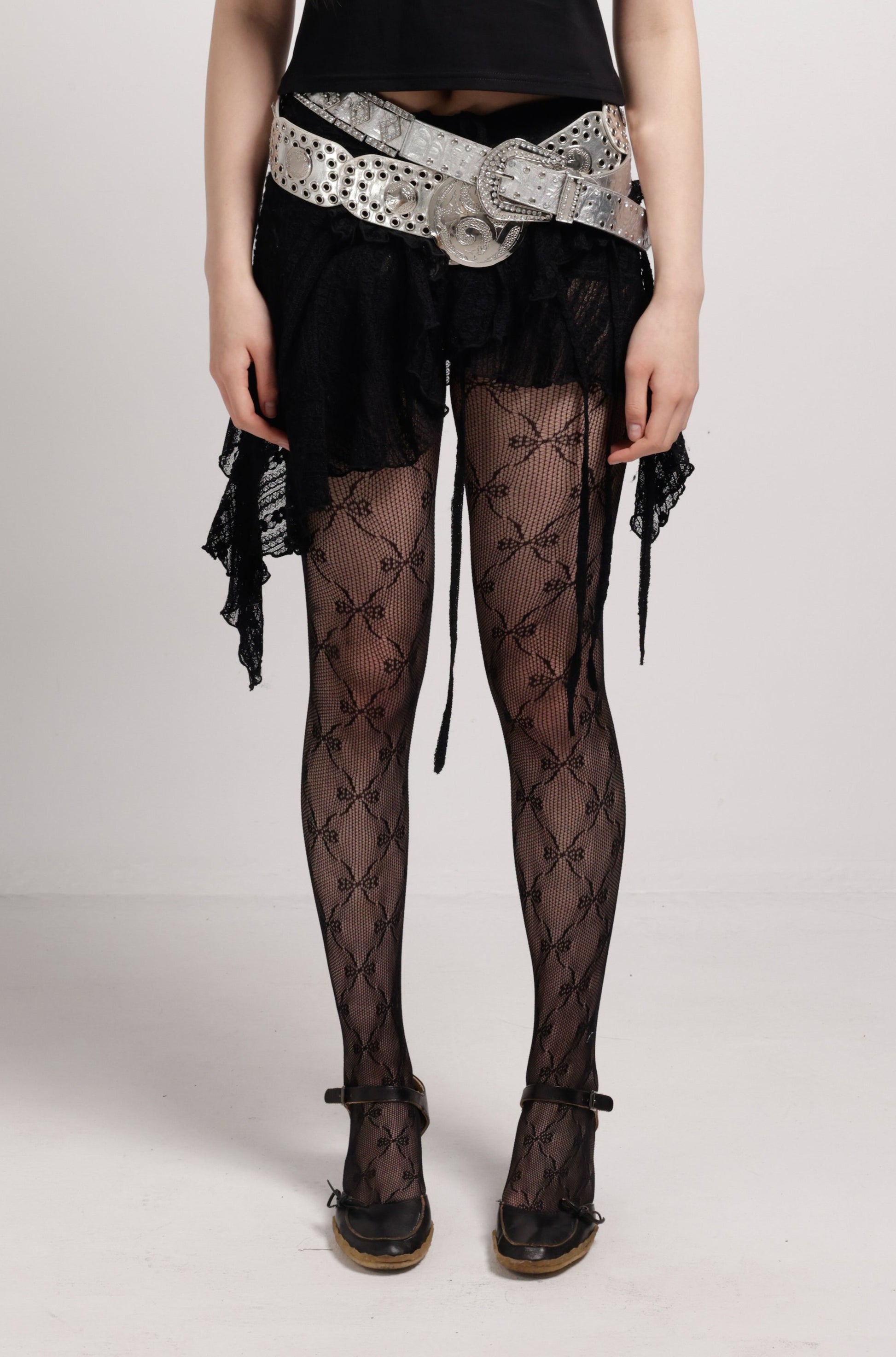 girl wearing black lace tights with black bows | Lace Me Up Tights in Black | Bow tights | Baobei Label