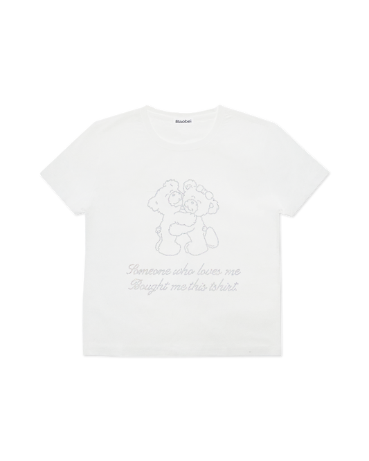 white tee shirt with rhinestone writing 'someone who loves me bought me this tshirt' and two bears hugging | Teddy Tee in White | Baobei Label