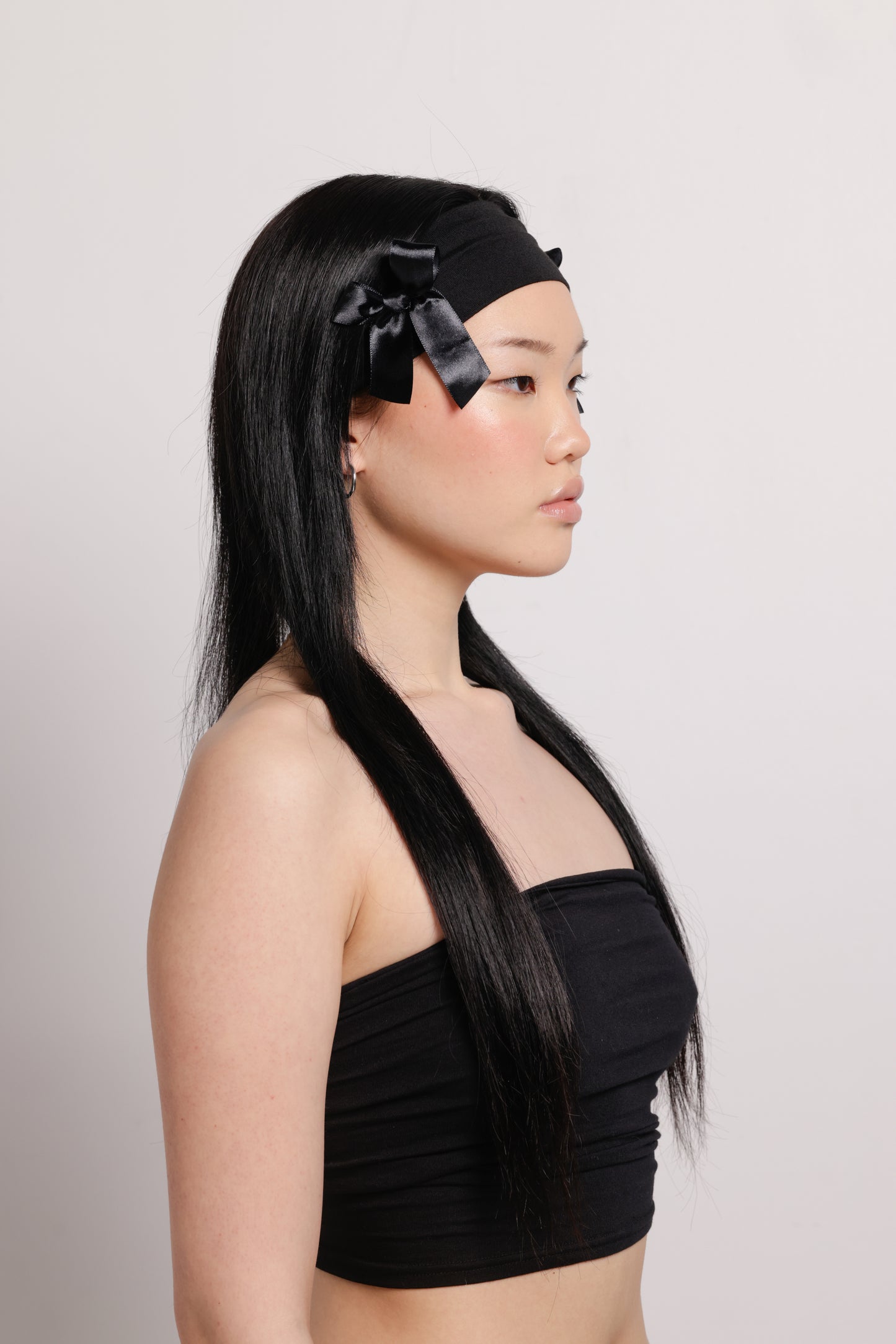 girl wearing black headband with two black bows on both side | Bow Me a Kiss | Baobei Label | Headband | Buttermilk Accessories