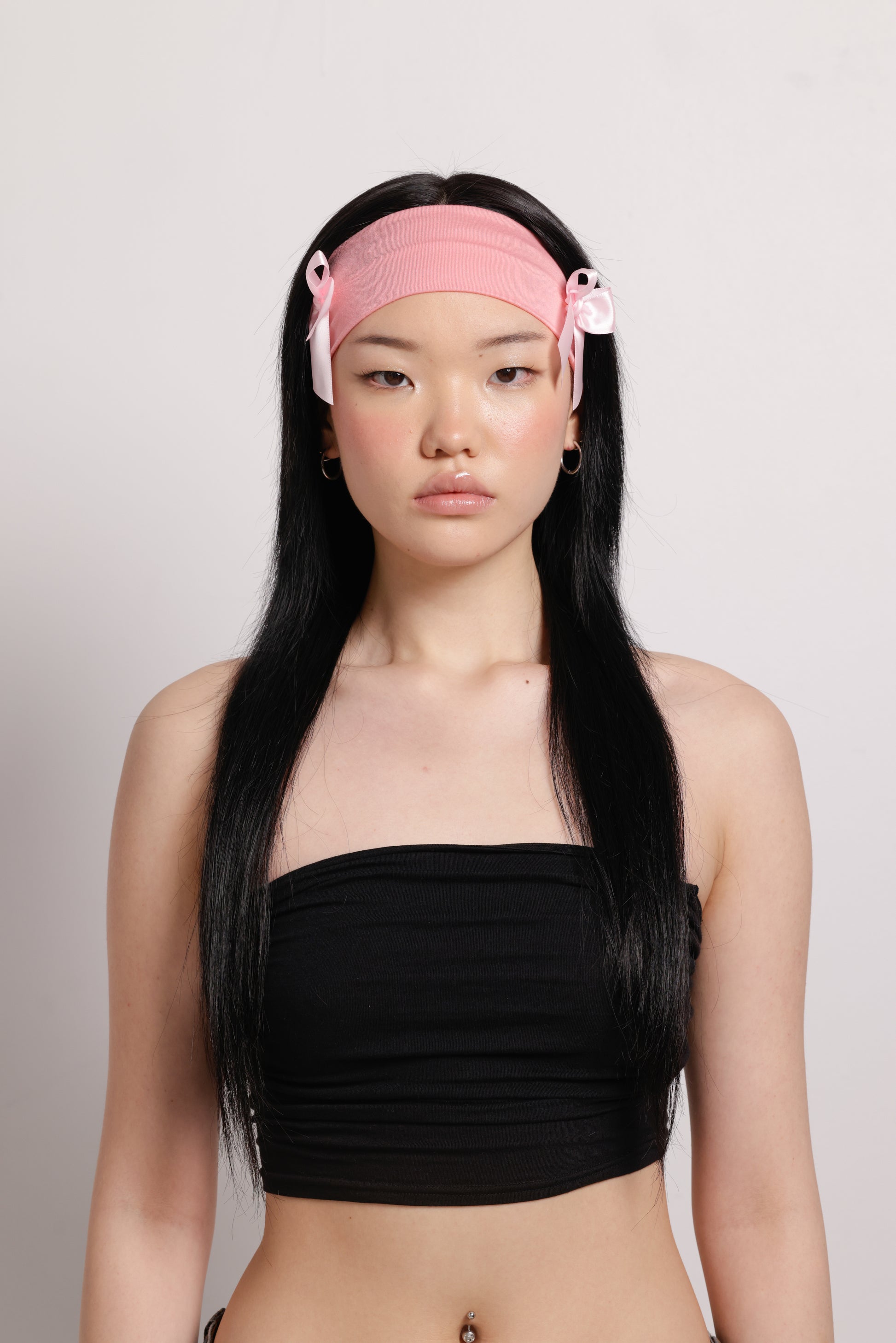 girl wearing pink headband with two pink bows on both side | Bow Me a Kiss | Baobei Label | Headband | Buttermilk Accessories