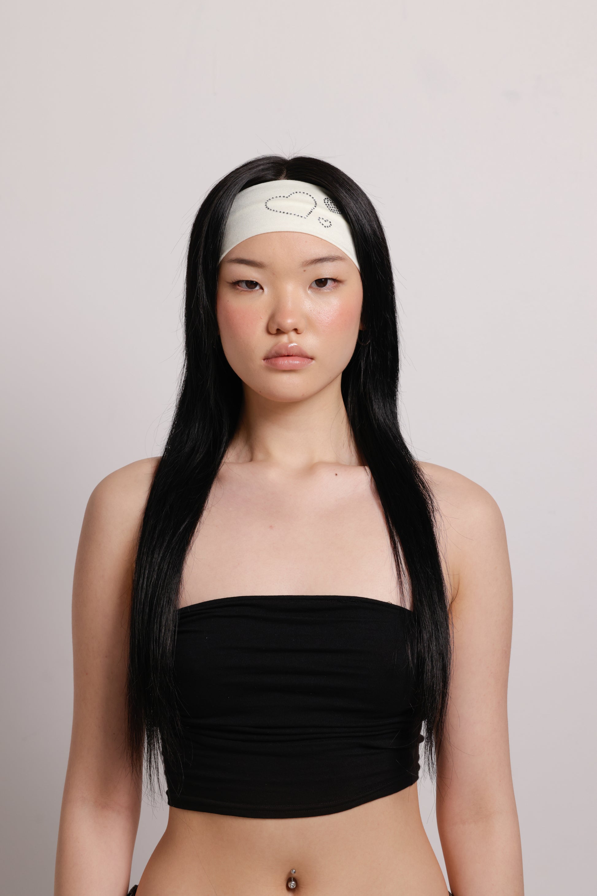 girl wearing white headband with silver diamonte