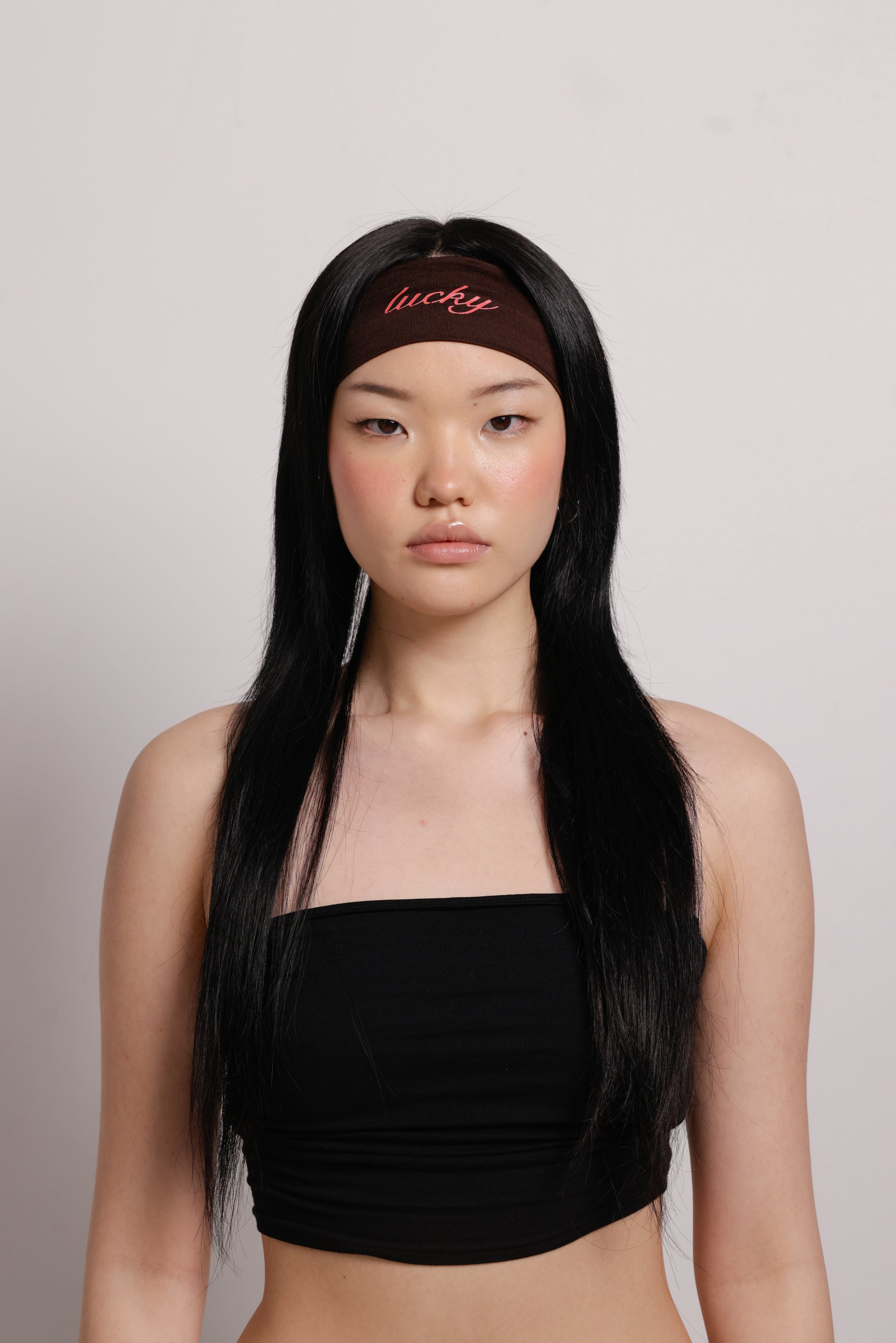 girl wearing brown headband with red linked text 'lucky' | Lucky Girl in Boba | Brown Headband | Baobei Label 